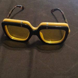 Cream and black sunglasses